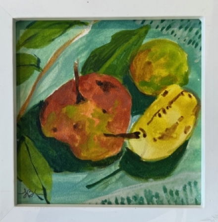 Three pears on a green cloth