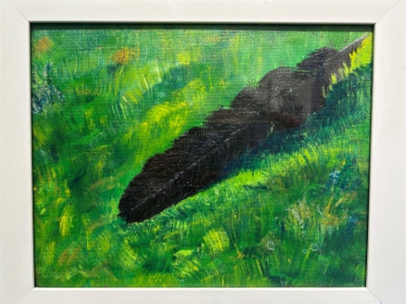 Crow Feather in the Grass